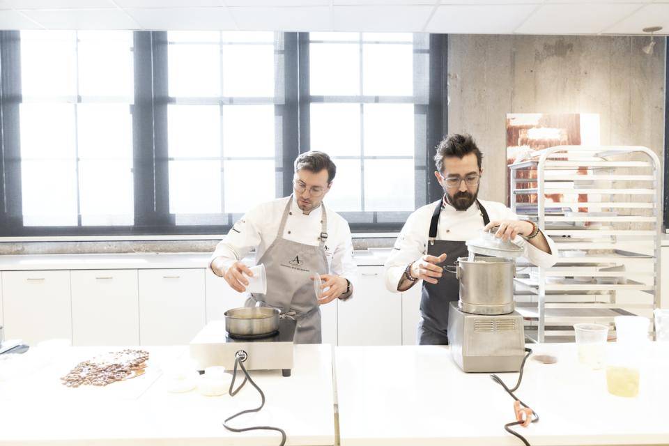 Chefs Nicoll Notter and Dimitri Fayard at work in the new kitchen at Chocolate Academy™ NYC