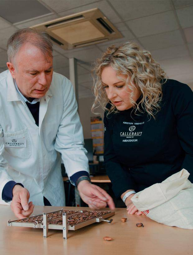 Kirsten Tibballs and callebaut chocolate expert checking the cocoa beans 