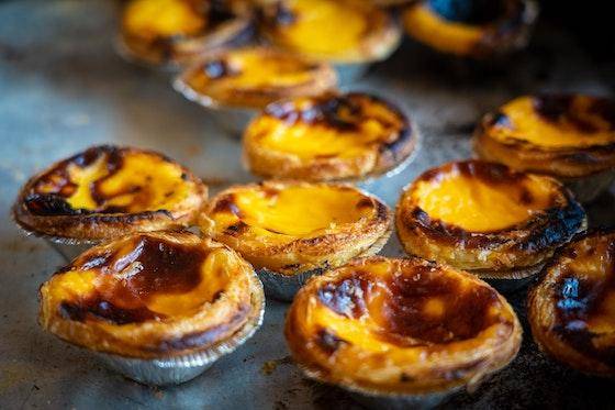 a collection of Portuguese Egg Tarts (Pastéis de Nata)