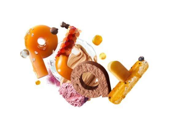 The word "play" spelled out using different pastry elements
